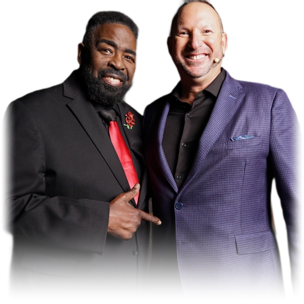 Les Brown and Michael Fineman standing together, Les pointing toward Michael